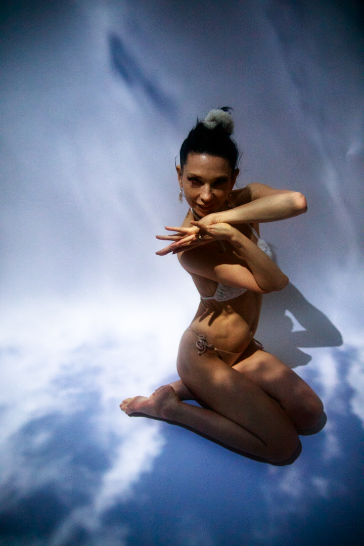 A women sitting in the sky.